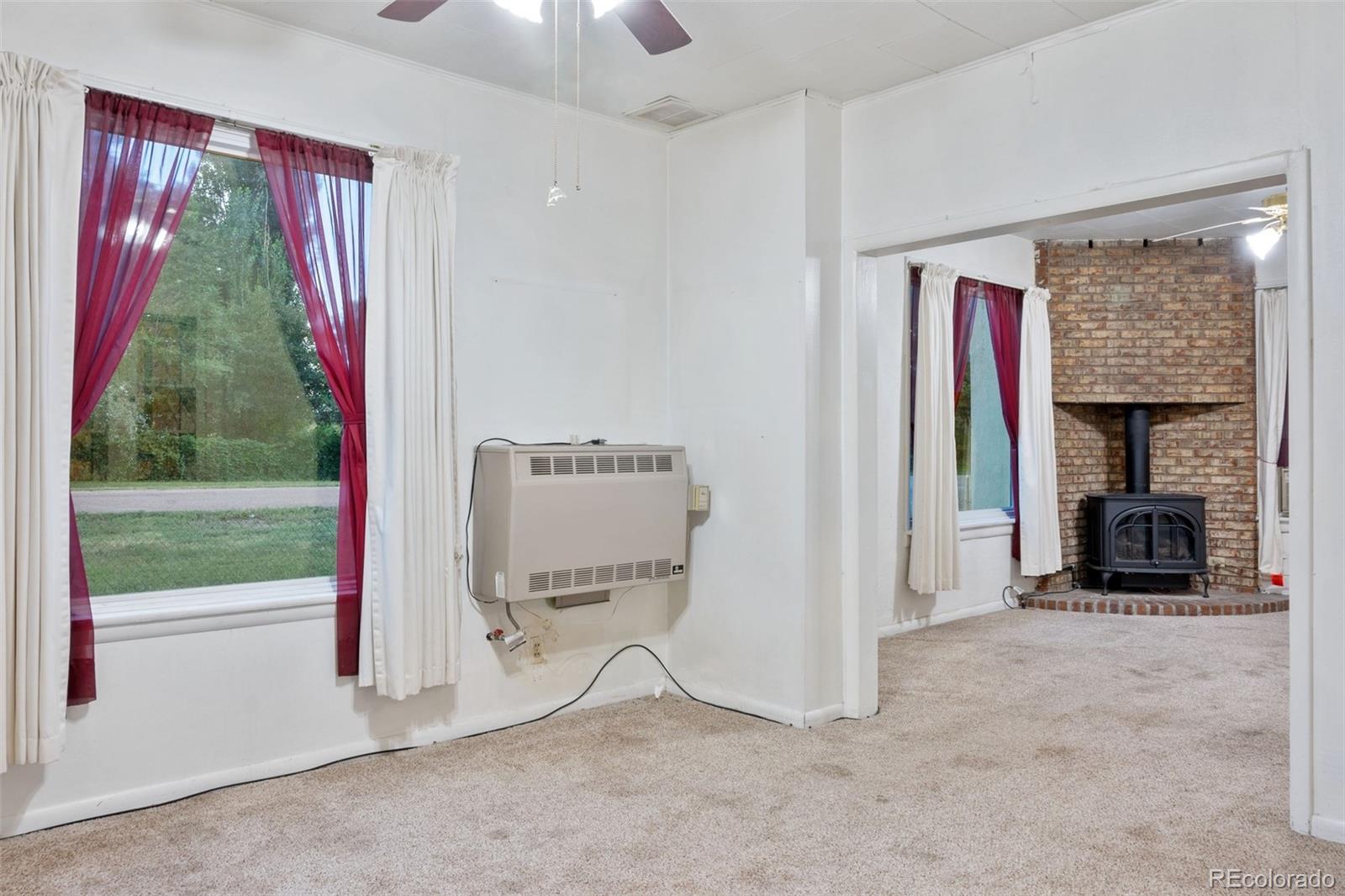 101 3rd Street Ramah, CO 80832 - Photo 4 of 24 a view of a room with a window and a fireplace