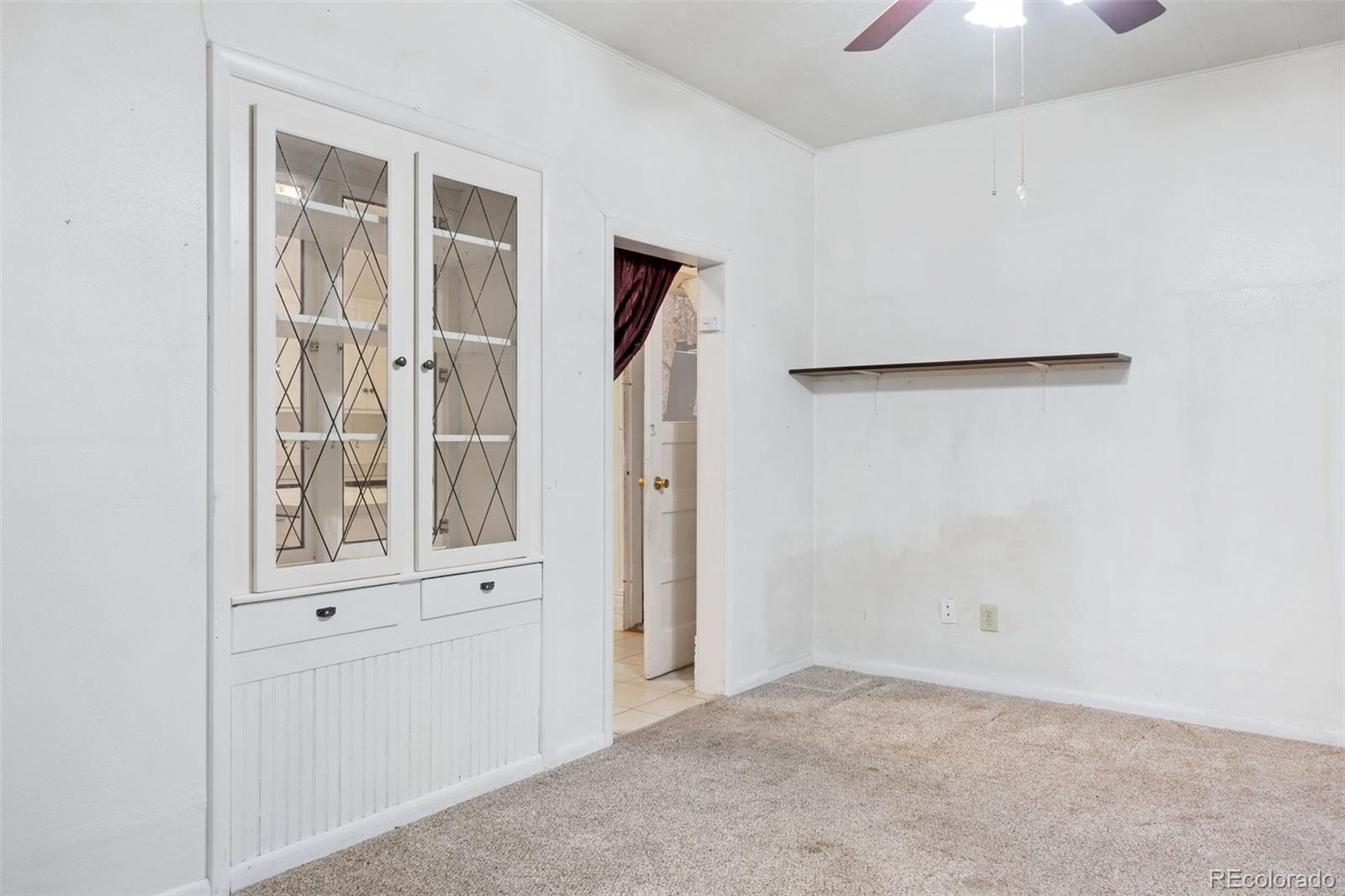 101 3rd Street Ramah, CO 80832 - Photo 6 of 24 an empty room with windows and entryway