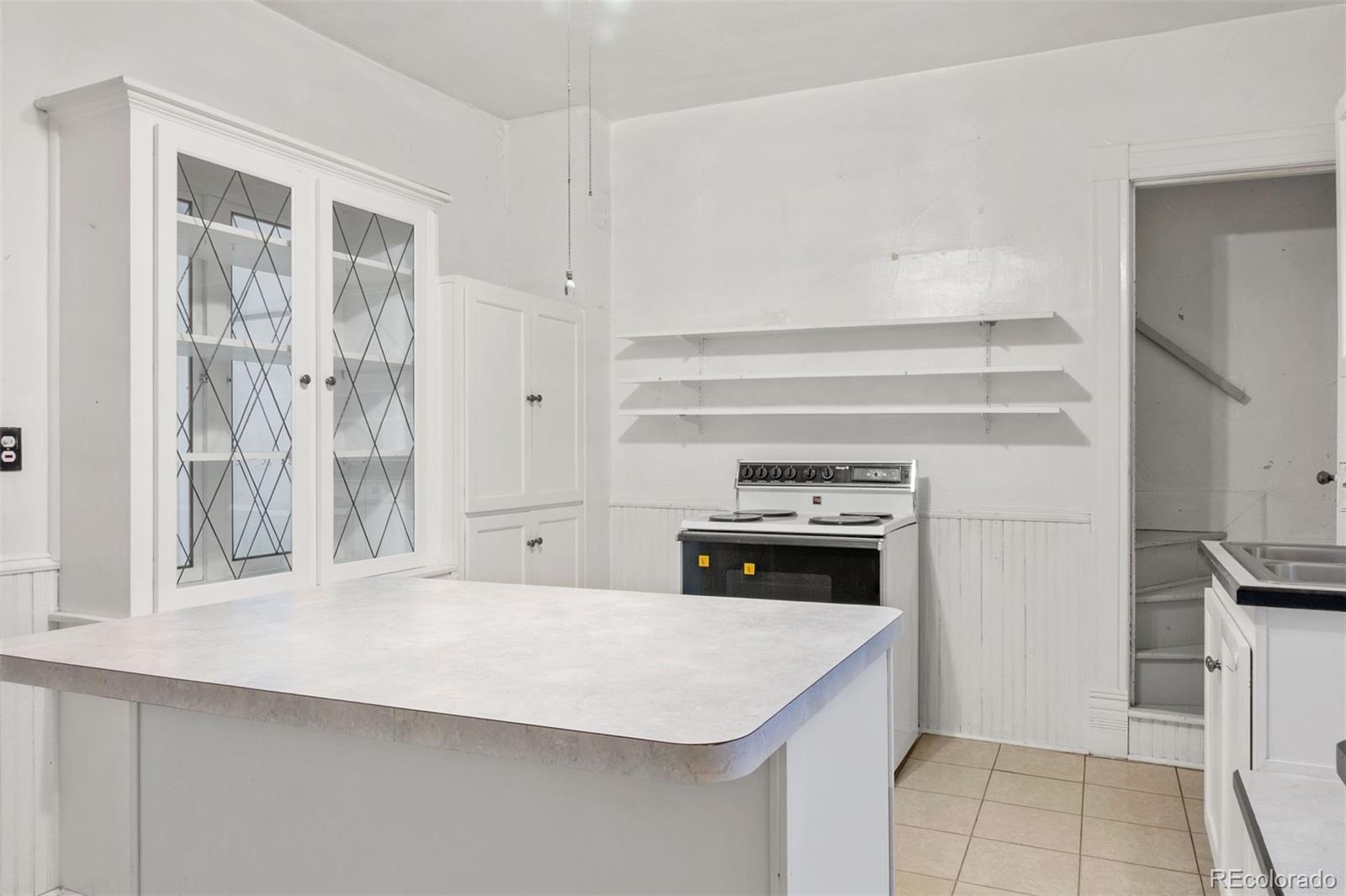 101 3rd Street Ramah, CO 80832 - Photo 7 of 24 a kitchen with a stove and a refrigerator