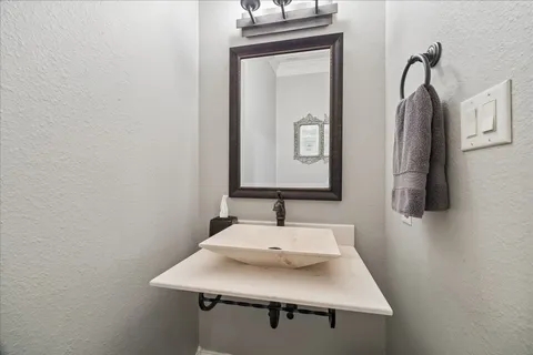 a bathroom with a sink vanity and a mirror
