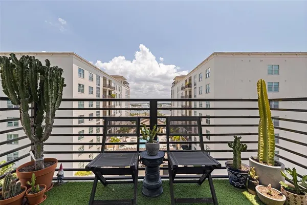 a view of a chairs and table in a patio