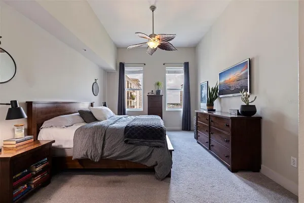 a bedroom with bed and window