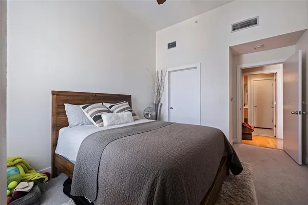 a bedroom with a bed and with closet