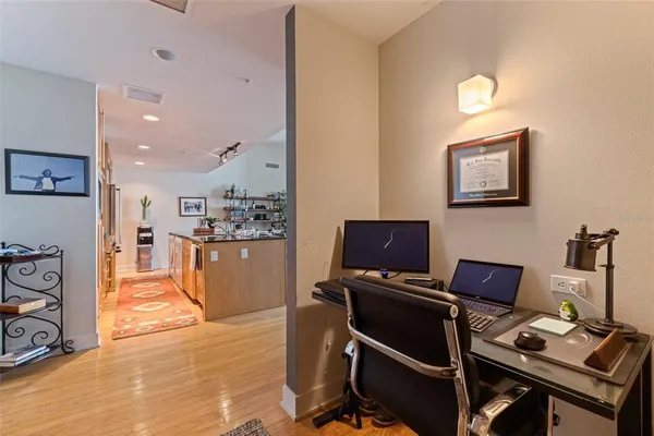 a workspace with furniture and screen
