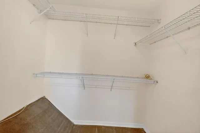 a view of a room with racks on the wall