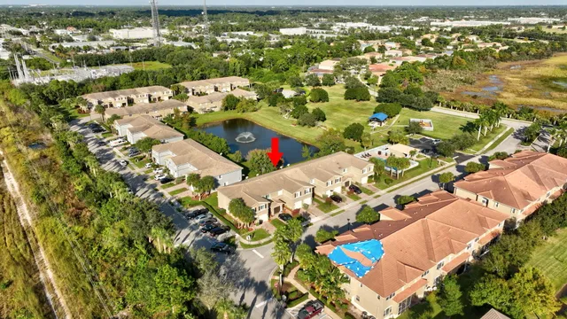 an aerial view of a house with a lake view