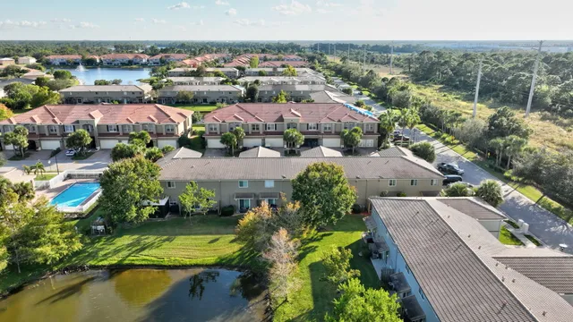 an aerial view of a house with a garden and swimming pool