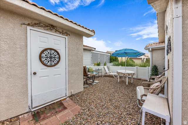 2990 East Riverside Drive, Unit 166 St. George, UT 84790 - Photo 4 of 22 Property entrance with stucco siding and a tiled roof
