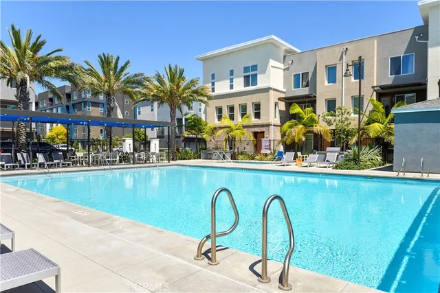 a backyard of a house with outdoor seating