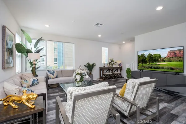 a living room with furniture and a large window