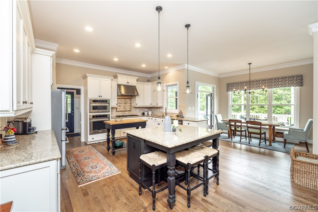 11724 Winterpock Road Chesterfield, VA 23838 - Photo 15 of 50 a large kitchen with a table and chairs