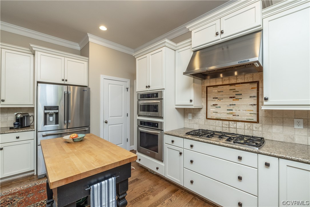 11724 Winterpock Road Chesterfield, VA 23838 - Photo 16 of 50 a kitchen with refrigerator cabinets and stove