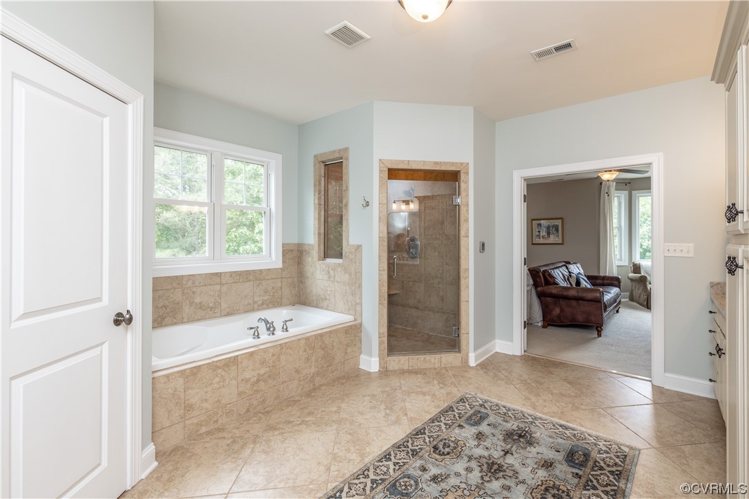 11724 Winterpock Road Chesterfield, VA 23838 - Photo 28 of 50 a en suite spacious bathroom with a tub shower and hallway