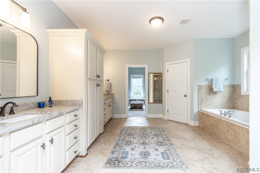 11724 Winterpock Road Chesterfield, VA 23838 - Photo 30 of 50 a spacious bathroom with double vanity and mirrors