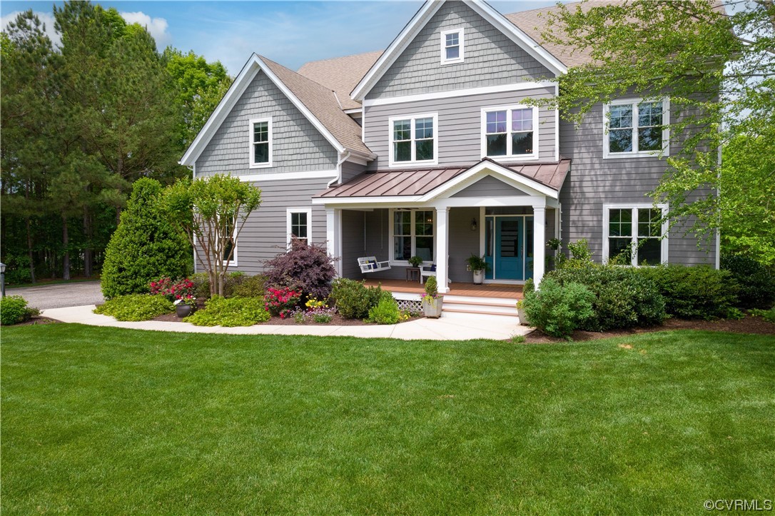 11724 Winterpock Road Chesterfield, VA 23838 - Photo 3 of 50 a front view of a house with a yard and potted plants