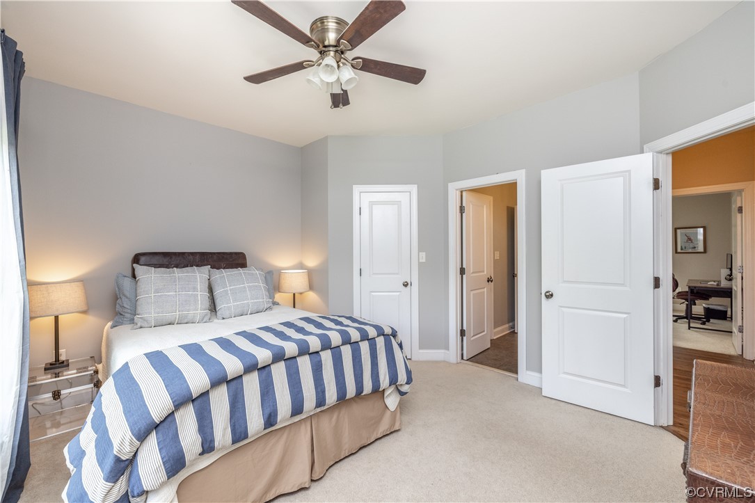 11724 Winterpock Road Chesterfield, VA 23838 - Photo 33 of 50 a bedroom with a large bed and a chandelier