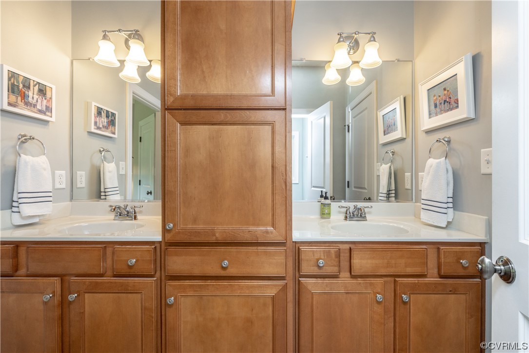 11724 Winterpock Road Chesterfield, VA 23838 - Photo 34 of 50 a bathroom with a sink vanity and a mirror
