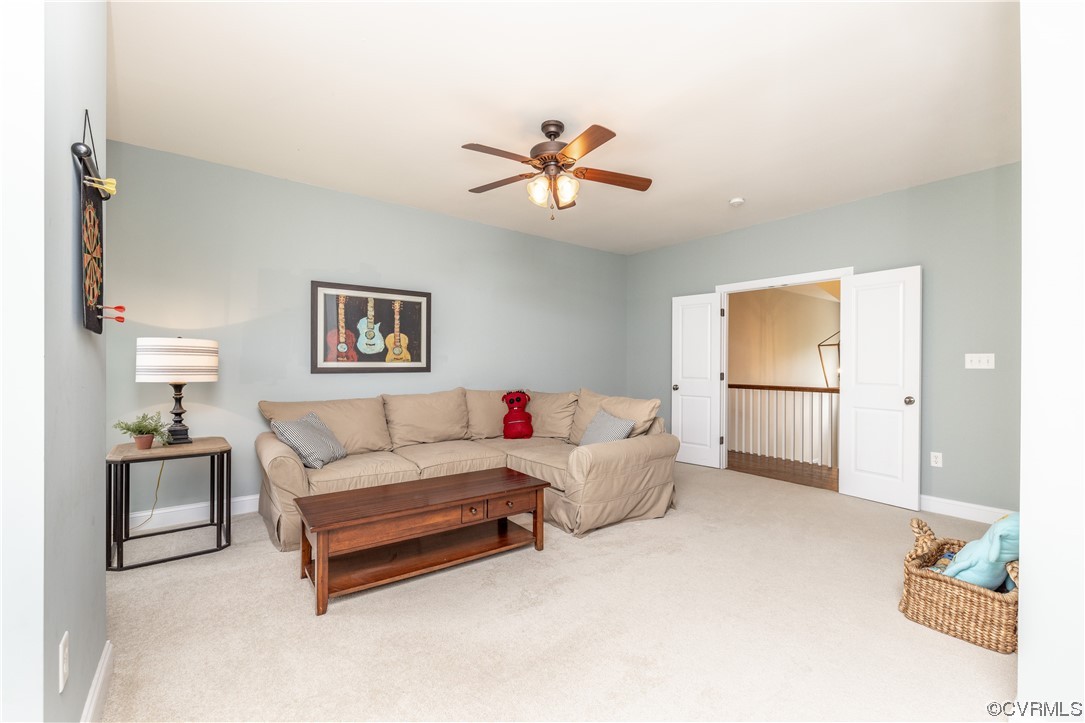 11724 Winterpock Road Chesterfield, VA 23838 - Photo 36 of 50 a living room with furniture and a chandelier