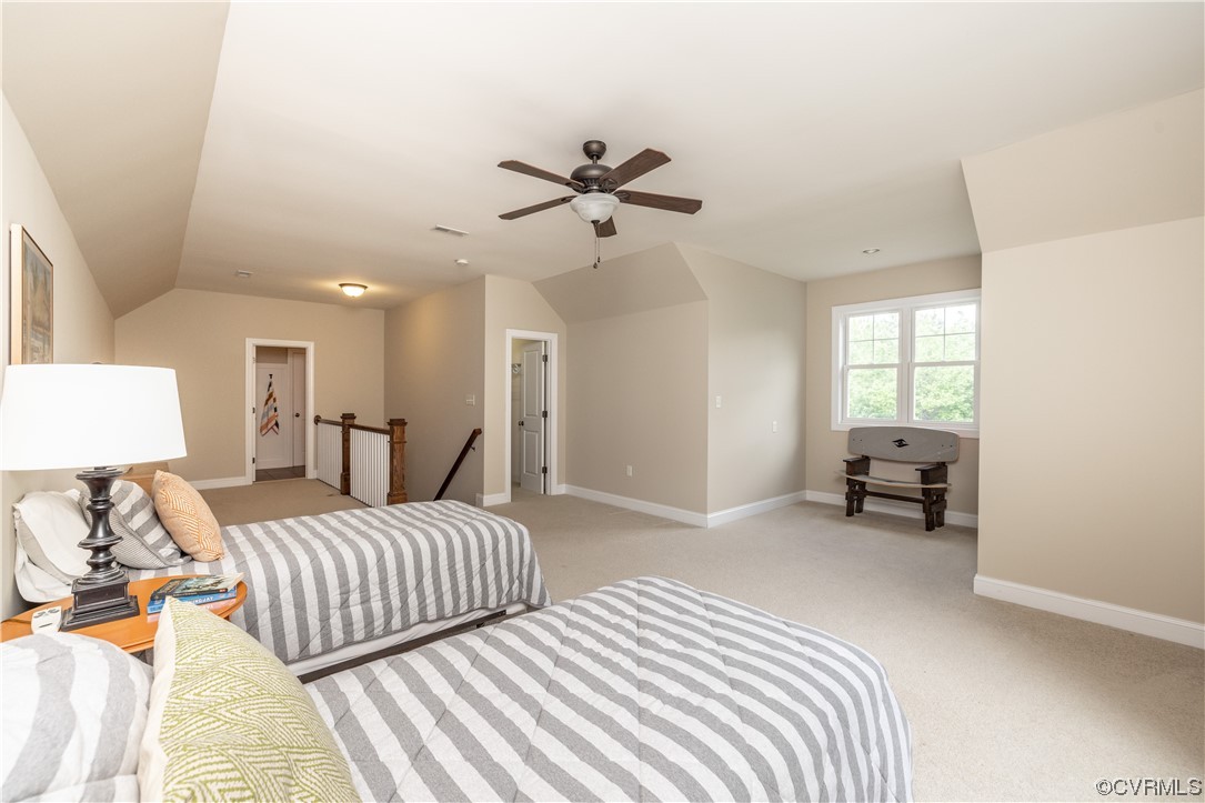 11724 Winterpock Road Chesterfield, VA 23838 - Photo 38 of 50 a bedroom with a bed and a chandelier