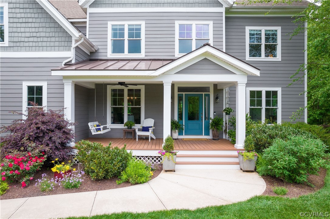 11724 Winterpock Road Chesterfield, VA 23838 - Photo 4 of 50 a front view of a house with a porch and a potted plant