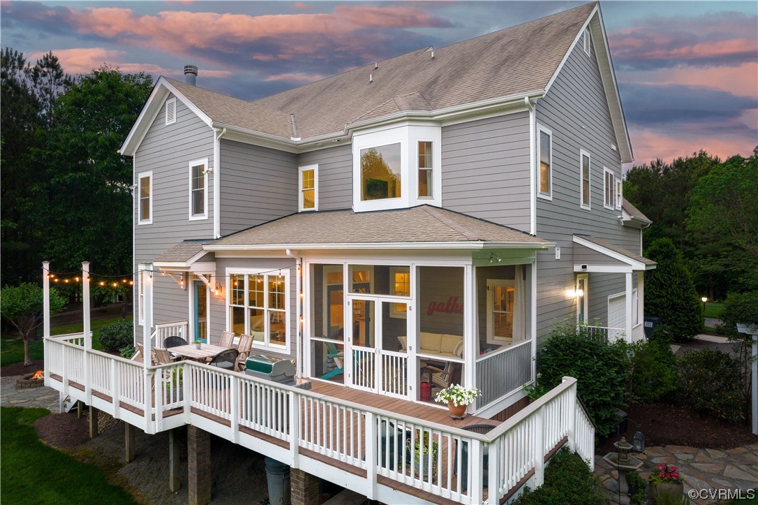 11724 Winterpock Road Chesterfield, VA 23838 - Photo 43 of 50 a view of a white house with a large windows and a yard
