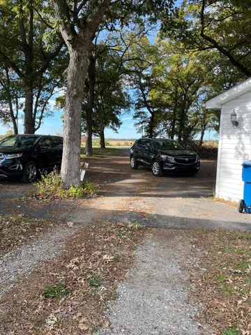 a view of a yard with a tree