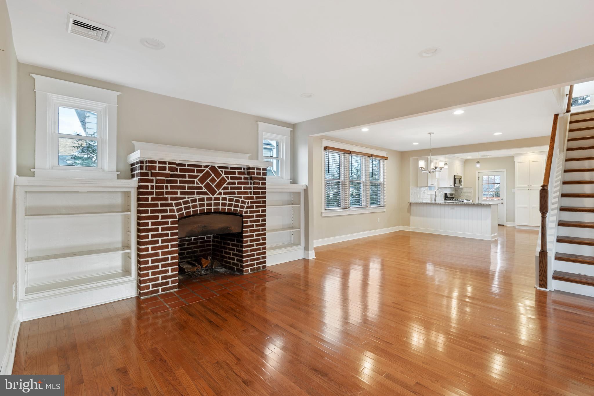 1201 Darby Road Havertown, PA 19083 - Photo 15 of 37 F.P. surrounded by bookshelves accent windows.