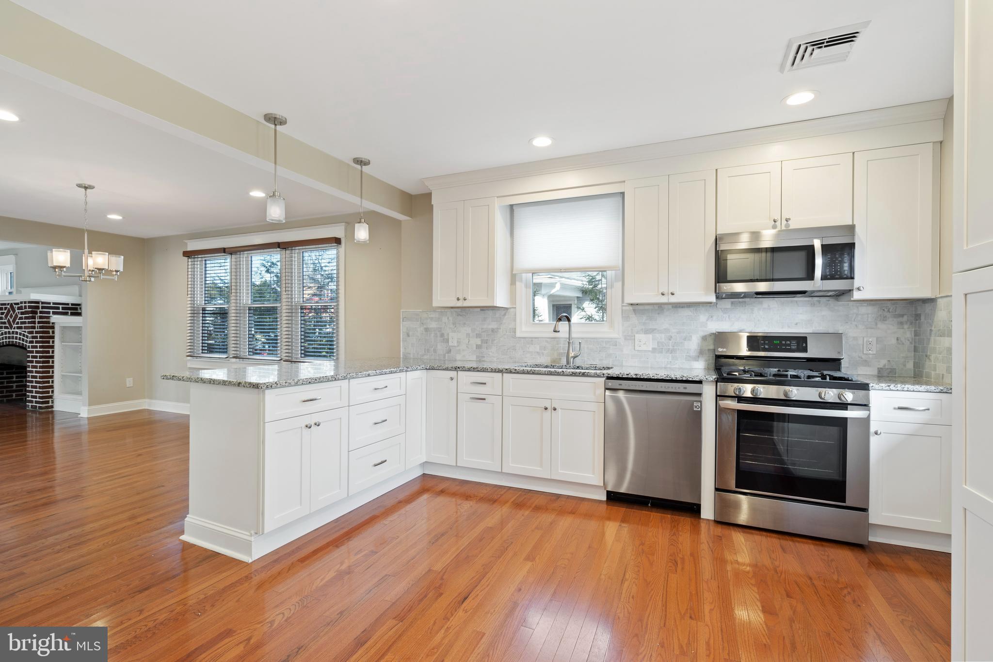 1201 Darby Road Havertown, PA 19083 - Photo 23 of 37 Granite counters, tile backsplash & SS appliances