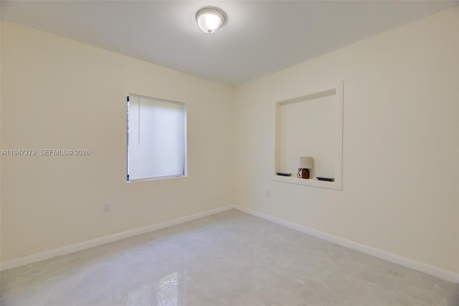 742 Northwest 70th Street, Unit 1 Miami, FL 33150 - Photo 12 of 30 an empty room with a window