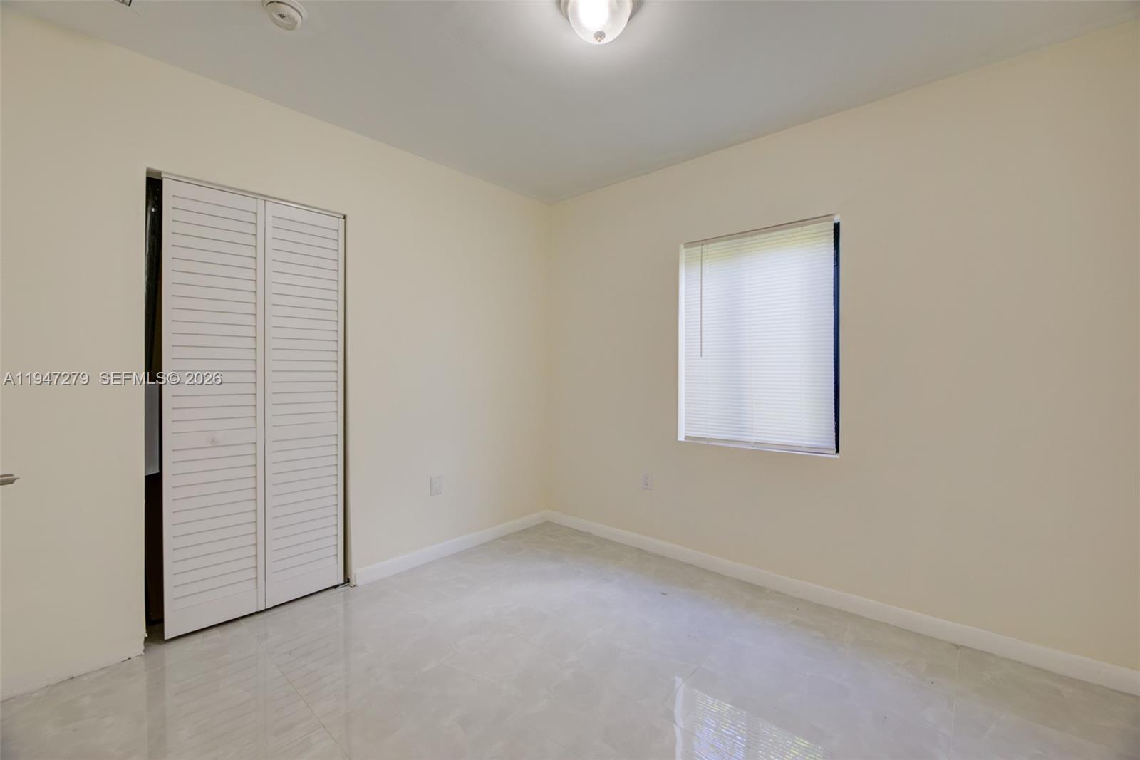 742 Northwest 70th Street, Unit 1 Miami, FL 33150 - Photo 14 of 30 an empty room with windows
