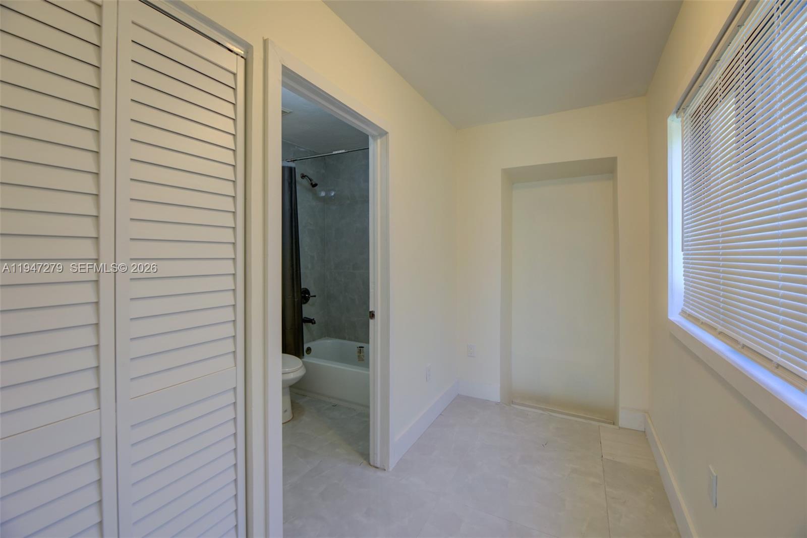 742 Northwest 70th Street, Unit 1 Miami, FL 33150 - Photo 15 of 30 a view of a bathroom from a hallway