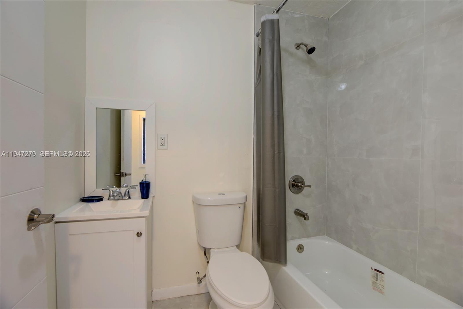 742 Northwest 70th Street, Unit 1 Miami, FL 33150 - Photo 17 of 30 a bathroom with a sink toilet and shower