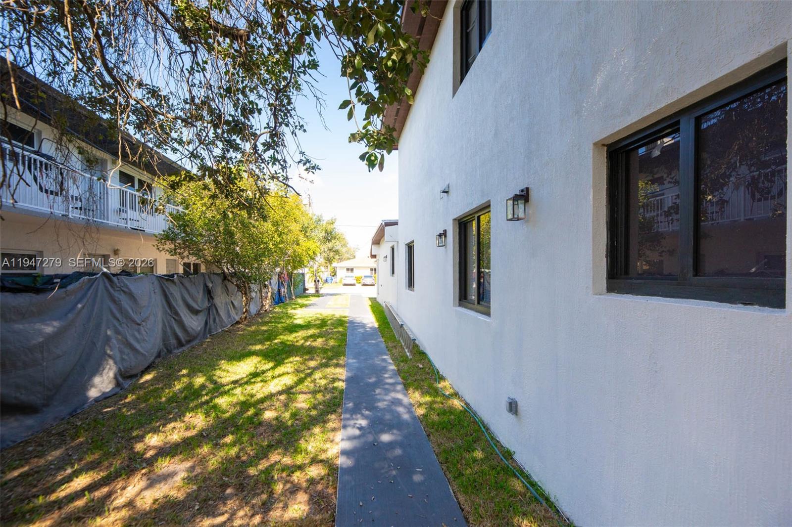 742 Northwest 70th Street, Unit 1 Miami, FL 33150 - Photo 24 of 30 a view of a backyard of the house