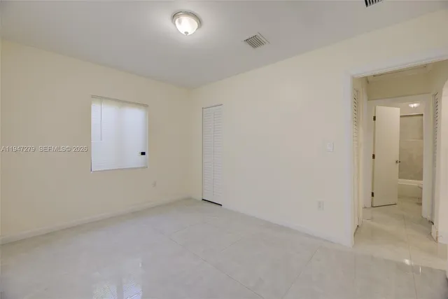 an empty room with a bathroom