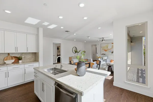 a view of kitchen with sink and living room