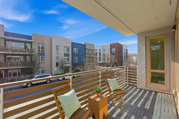 a bedroom with a bed and wall painting