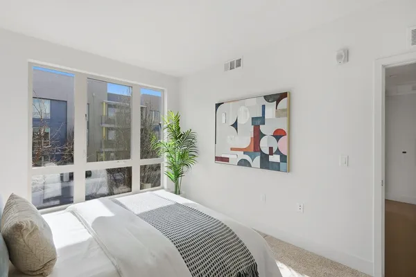 a bedroom with a bed and furniture