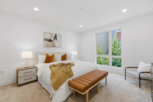 a bedroom with a bed and a walk in closet