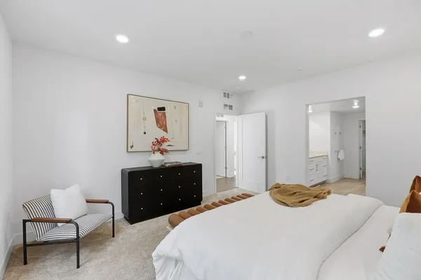 a bathroom with 2 sink tub and a mirror