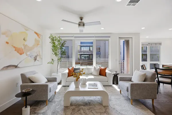 a living room with furniture and a large window