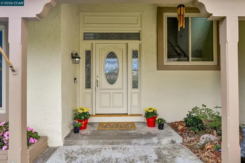 a view of a hallway with seating area