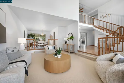 a living room with furniture or couch and a large window