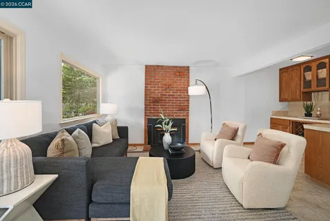 a view of a dining room with furniture window and outdoor view