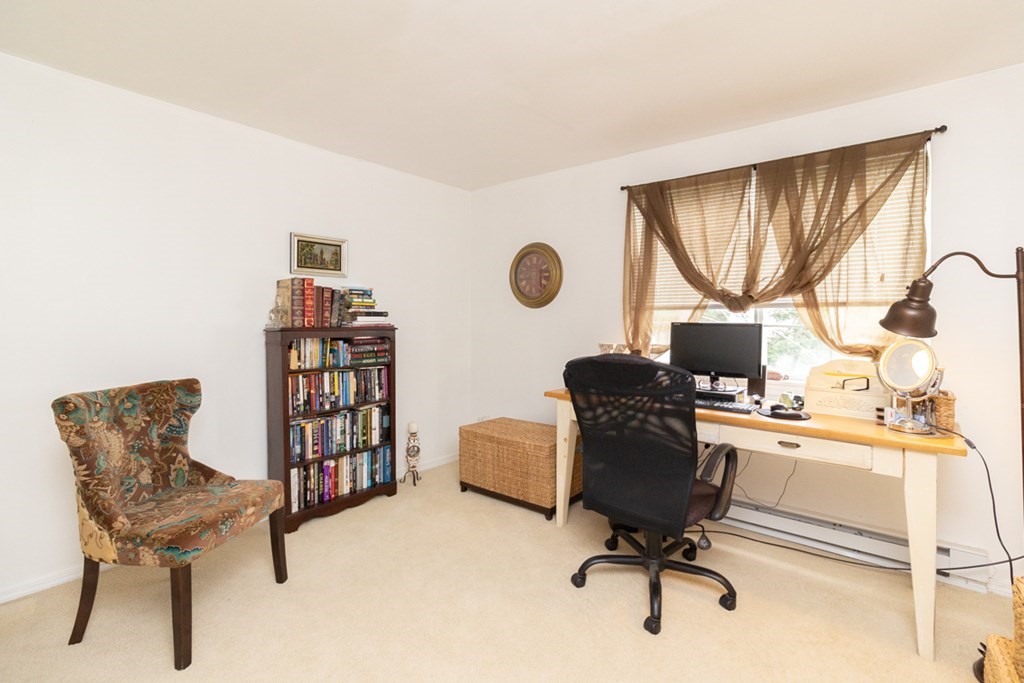 269 Chicopee Street, Unit 16 Chicopee, MA 01013 - Photo 18 of 26 a view of a workspace with furniture and a window