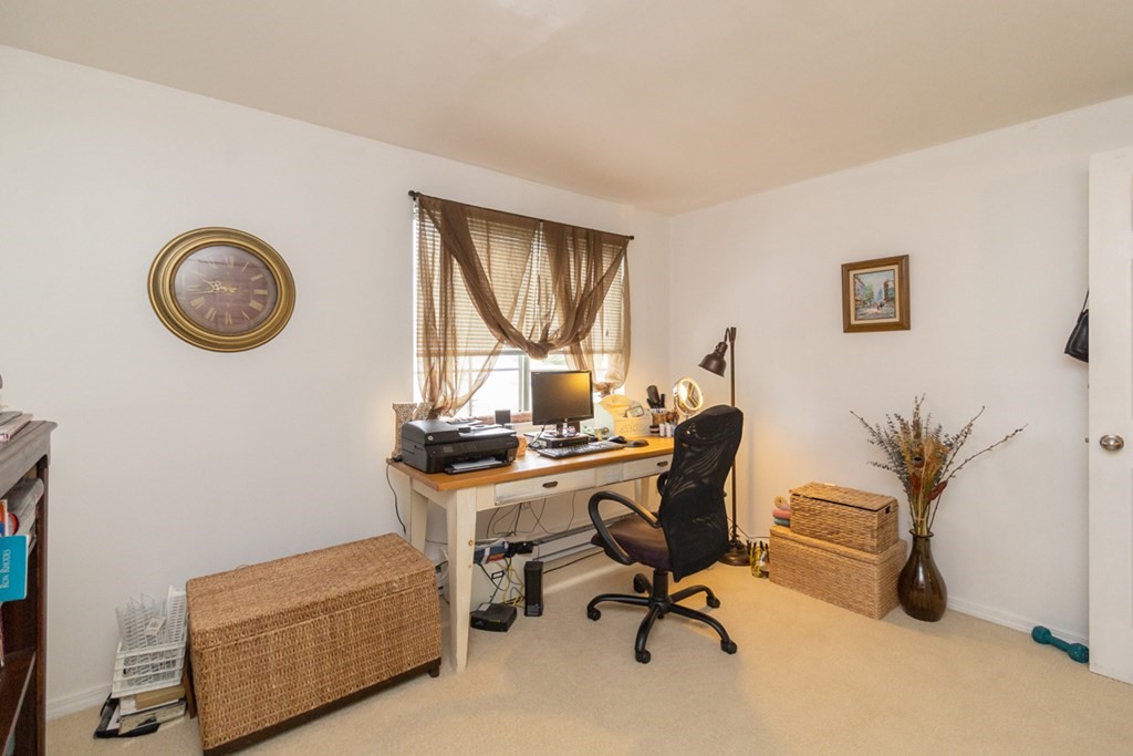 269 Chicopee Street, Unit 16 Chicopee, MA 01013 - Photo 21 of 26 a view of a workspace with a couch and a window
