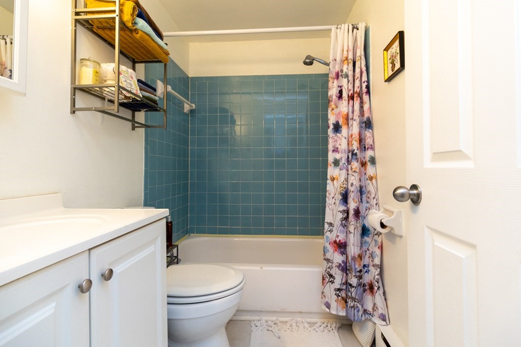 269 Chicopee Street, Unit 16 Chicopee, MA 01013 - Photo 22 of 26 a bathroom with a sink toilet and shower
