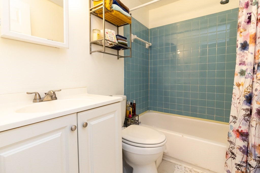 269 Chicopee Street, Unit 16 Chicopee, MA 01013 - Photo 23 of 26 a bathroom with a sink a toilet and bathtub