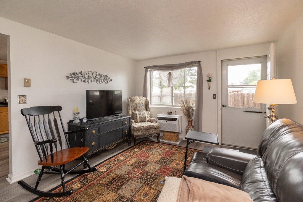 269 Chicopee Street, Unit 16 Chicopee, MA 01013 - Photo 7 of 26 a living room with furniture and a flat screen tv