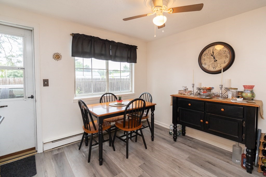 269 Chicopee Street, Unit 16 Chicopee, MA 01013 - Photo 9 of 26 a view of a dining room with furniture window and wooden floor