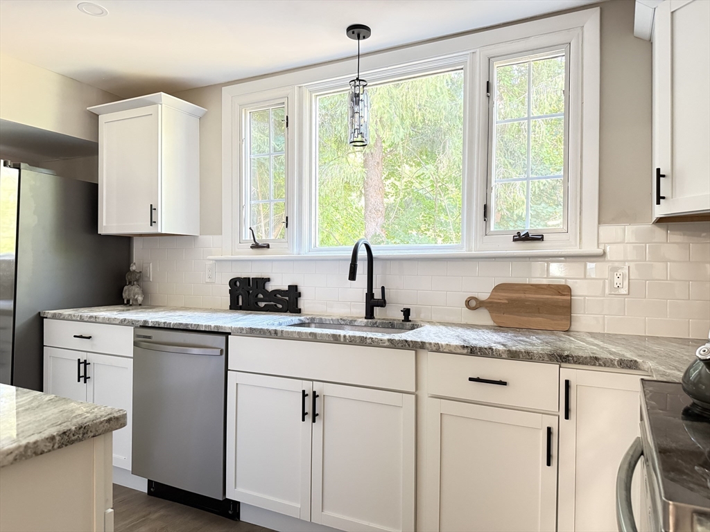 37 Bridge Street Monson, MA 01057 - Photo 1 of 35 a kitchen with a sink stove and cabinets